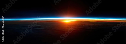 Earth's horizon with rising sun and blue atmosphere seen from space