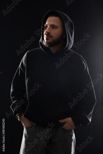 Young bearded man in black ...