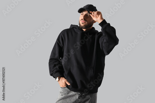 Young man in black hoodie w...