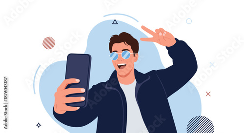 Happy young man in sunglasses taking a selfie with his smartphone and making a peace sign, for social media content.