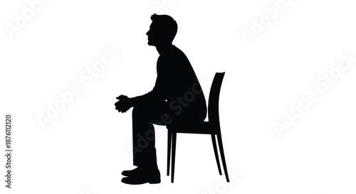 a man sitting on a chair in profile view