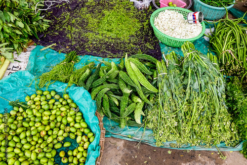 Selling fresh vegetables in a traditional market