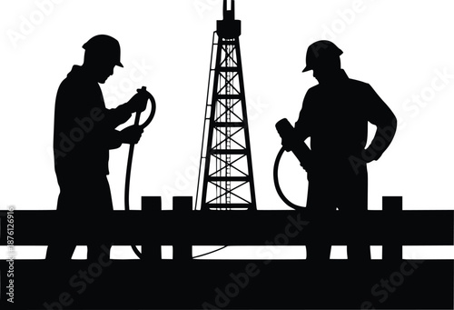 Workers operating oil drilling equipment