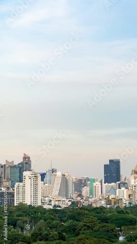 Bangkok cityscape time lapse transitioning from daytime to night with modern skyline and city lights.