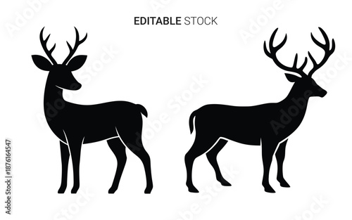 two black deer with antlers standing side by side in silhouette high quality