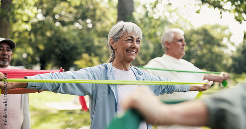 Quadro su tela Fitness, resistance band and class with old woman in park for learning, mobility exercise and health club