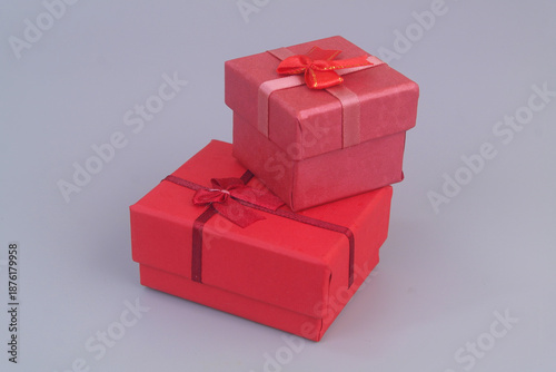 Two gift boxes on grey background. Birthday and resent concept. Copy space for text.