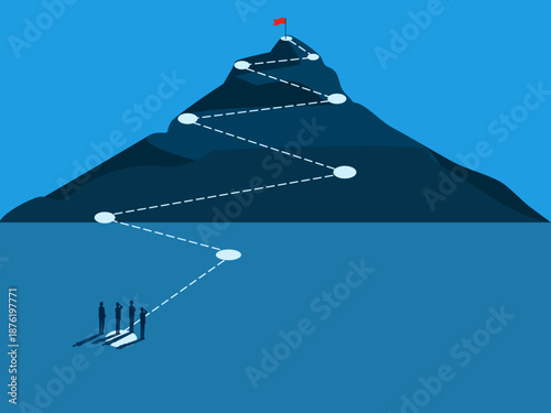 process of success,  the business team looks towards the flag at the mountaintop