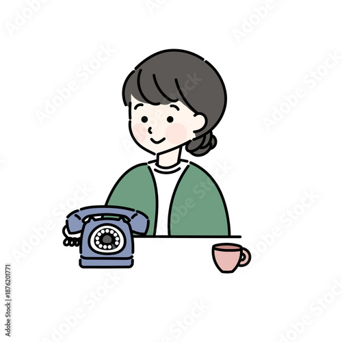 電話の前に座る女性