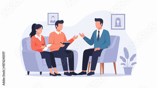 Three people in a meeting, two on a couch, one in a chair, discussing