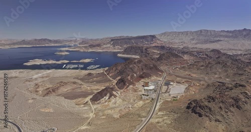 Lake Mead Nevada Aerial v9 flyover terrain capturing views of the basin, marina and a highway winding through arid desert landscape under clear blue sky - Shot with Mavic 3 Pro Cine - Apr 16th 2024