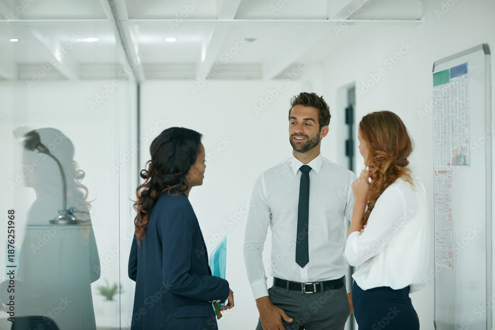 Obraz premium Discussing their opportunities for success. Cropped shot of colleagues having a discussion in an office.