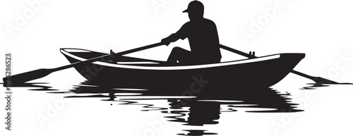 Silhouette of a man rowing a boat on water