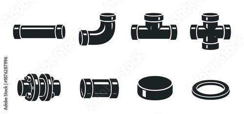 Black and white industrial pipe fittings on dark background