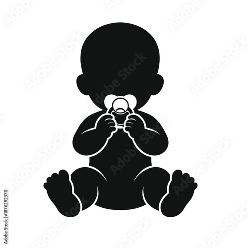 Silhouette of baby sitting with pacifier