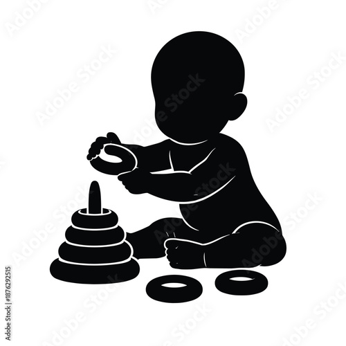 Baby playing with stacking rings toy silhouette