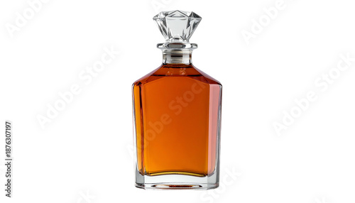 A crystal-topped decanter filled with amber liquid against a stark black background