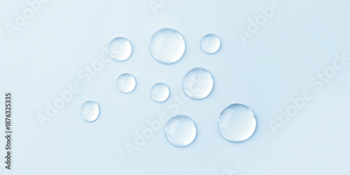 Εκτύπωση καμβά Transparent drops of cosmetics on a blue background