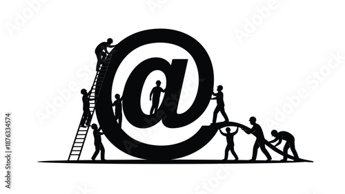 People working together to build a large email symbol with teamwork and collaboration