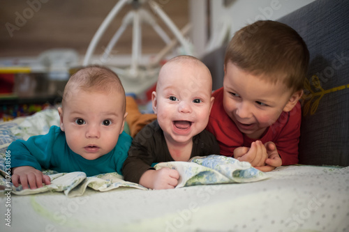 Vászonkép Three brothers are spending time together