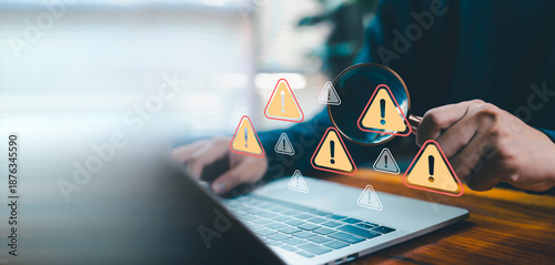 Business professional analyzing laptop data with magnifying glass and warning alert icons, representing risk assessment, cybersecurity threat detection, system audit, software error, data protection.