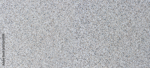 Fotografie Gray speckled granite aggregate concrete texture background