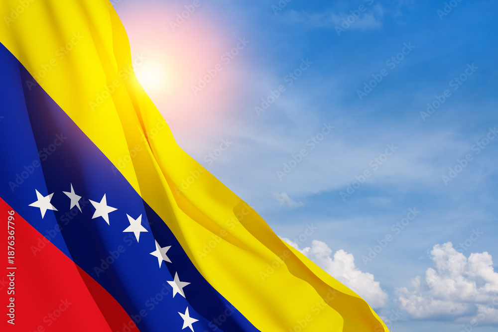 Fototapeta premium Venezuela flag on background of blue sky. Patriotic concept. Banner with place for text.
