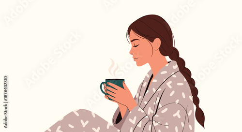 Peaceful young woman in a patterned bathrobe enjoying a warm cup of coffee or tea while relaxing in the morning.