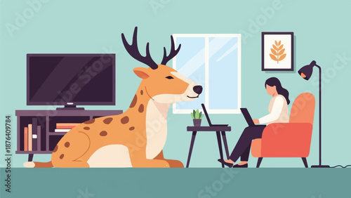 A deer rests inside a room while a person works on a laptop