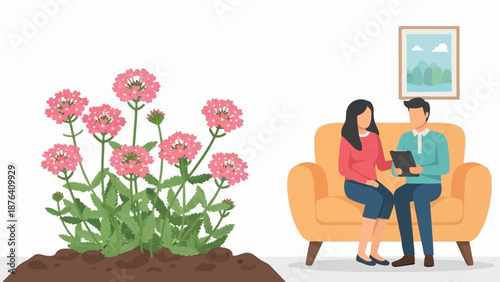 A couple sits on a couch, looking at a tablet, near a flowering plant