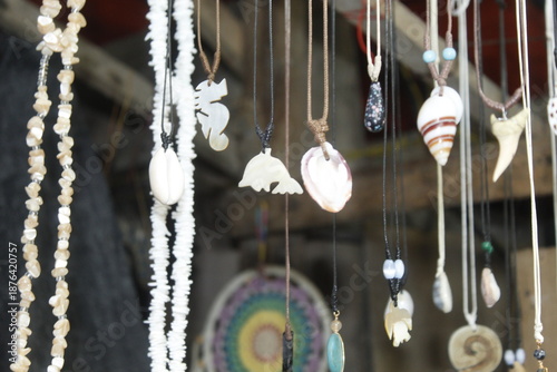 Tribal native accessories in a Display Collection stand on a Beach