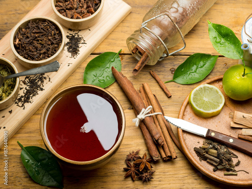 Herbal Spice Tea with Cinnamon, Star Anise, and Cloves on Wooden Table