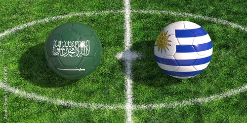 Soccer balls with Saudi Arabia and Uruguay flags on green grass football pitch