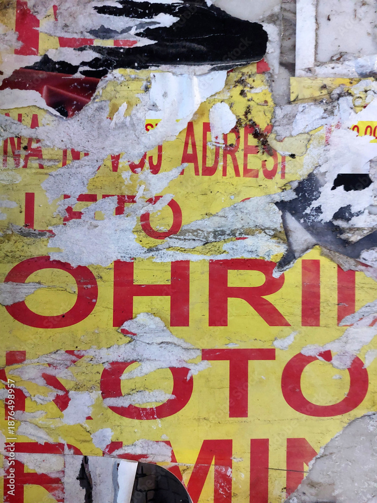 Fototapeta premium Torn and ripped street poster background, old and grungy paper, artistic collage