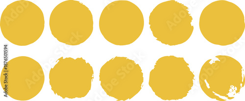 A collection of ten oval shaped yellow paint swatches on a white background