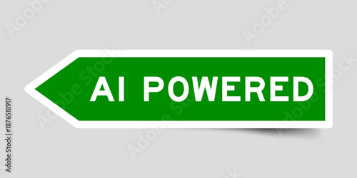 Green color arrow shape sticker label with word AI powered on gray background