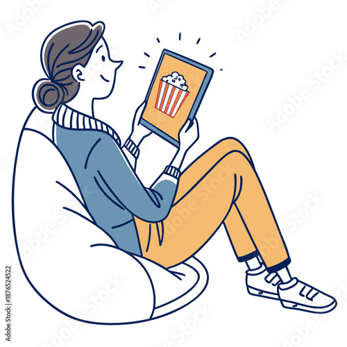 Woman watching a movie on tablet in beanbag comfort