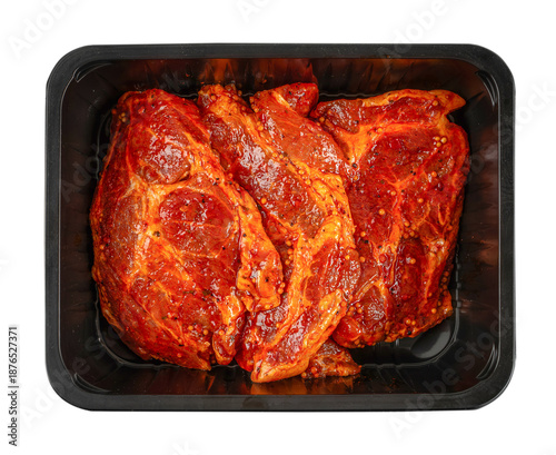Φωτογραφία Top view of raw beef steaks coated in spicy marinade with mustard seeds packed i
