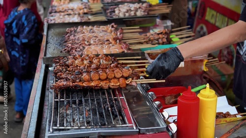 Grilling Bakso Meatball Skewers at Street Food Stall