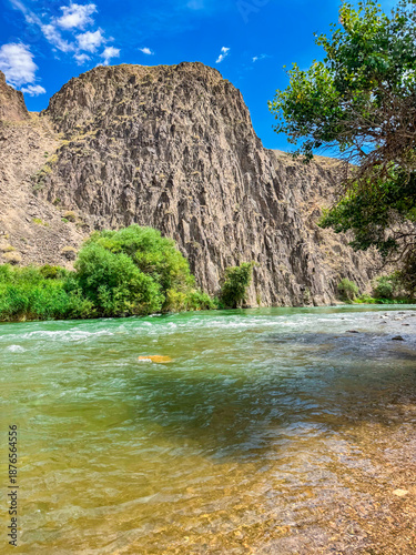 Beautiful Scenic Landscape of a River Surrounded by Majestic Cliffs and Lush Green Trees Bishkek, Kyrgyzstan