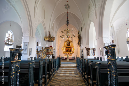 Sankt Laurentii Kirke church interior with nave, pews and Renaissance altarpiece, Kerteminde, Funen, Southern Denmark
