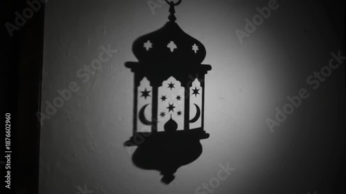 Ramadan lantern shadow on wall, traditional Islamic decoration for holy month.