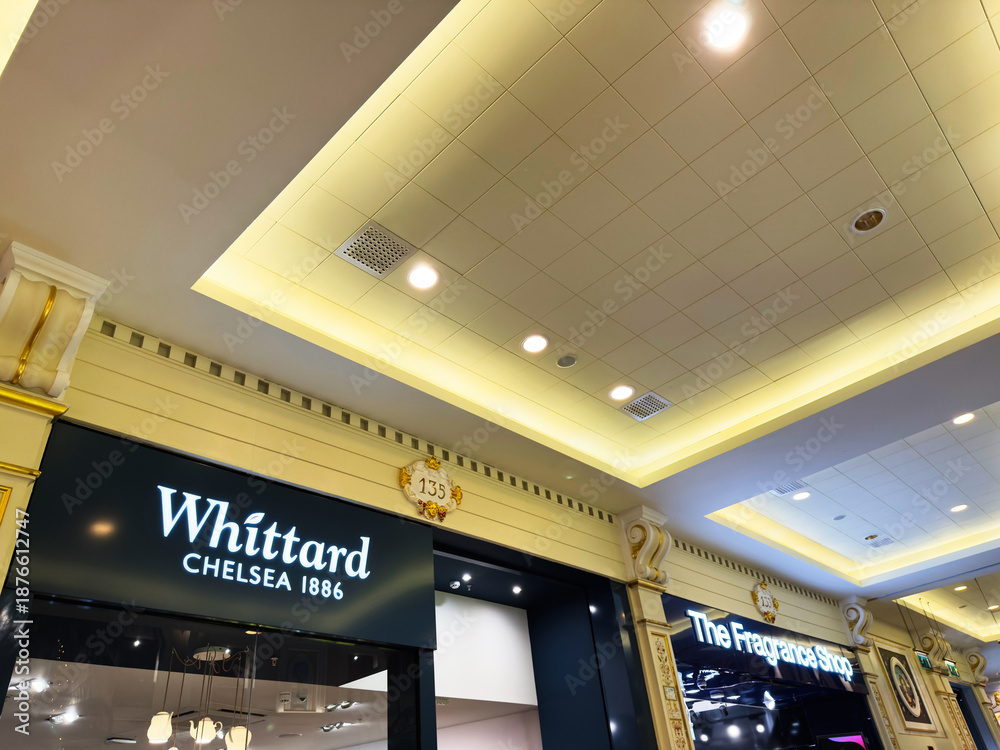 Obraz premium Whittard Chelsea 1886 and The Fragrance Shop storefronts in Manchester UK mall interior