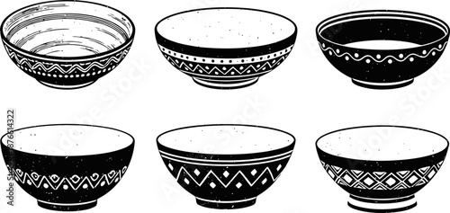 Traditional ceramic bowls with decorative ethnic patterns in black and white variations