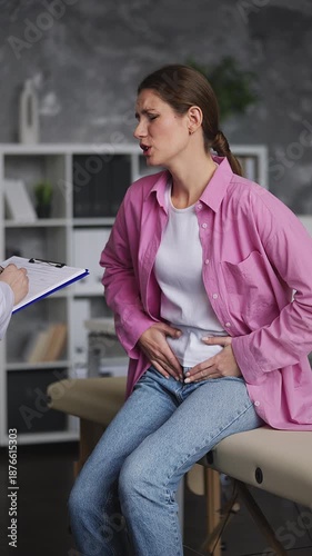 Upset young woman discussing sharp lower abdominal pain with urologist