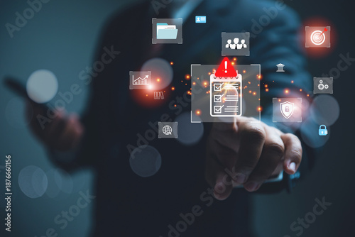 A businessman in a suit uses hand to touch a digital risk assessment checklist with an alert icon.