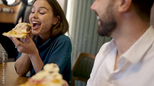Couple Sharing Pizza in Cafe