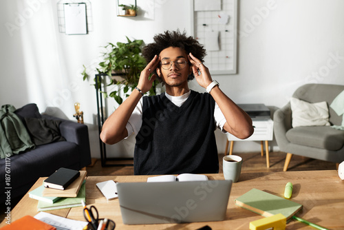 Fotografi Modern young man finding peace while working in his cozy home environment