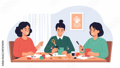 Three people are crafting together at a table with art supplies