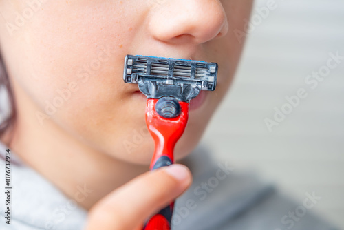 Εκτύπωση καμβά Young teenage boy 13 years old trying first shave, growing up, puberty beginning